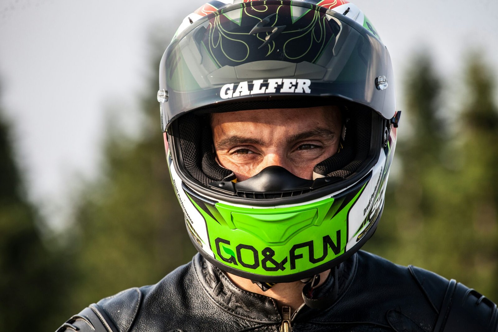 man wearing black multicolored helmet