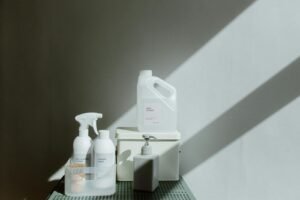 Simple arrangement of cleaning products with dramatic lighting and shadows.