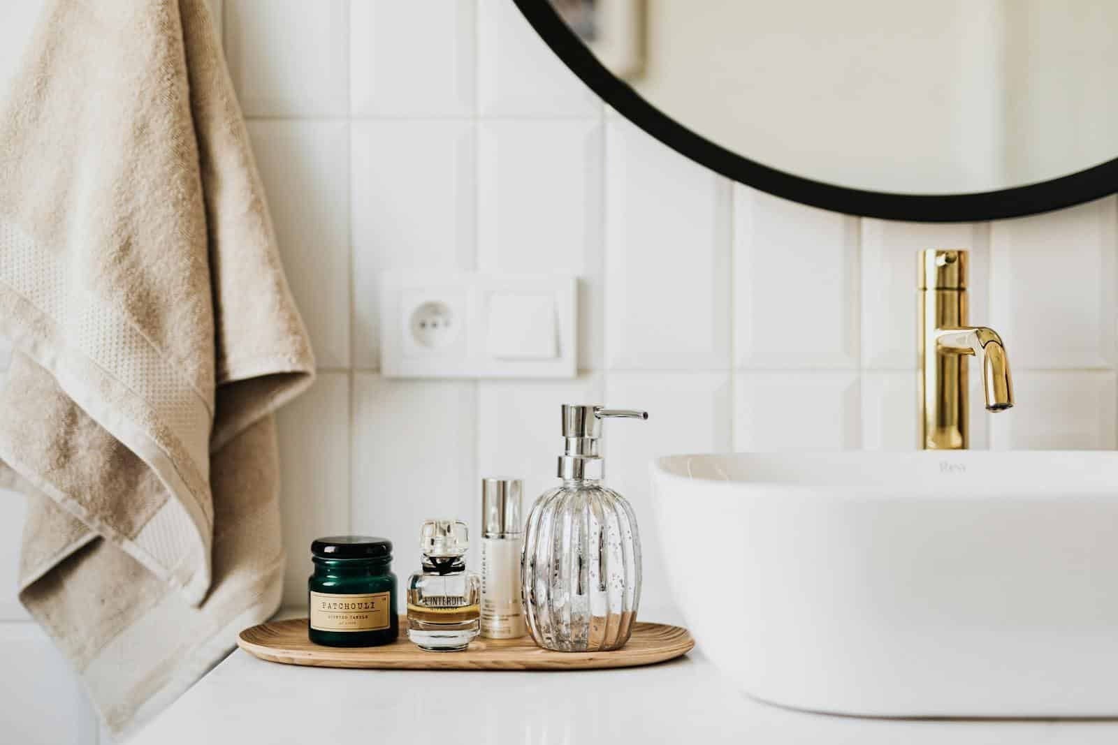 A stylish bathroom sink with skincare products and accessories for modern living.